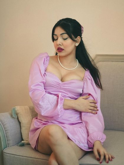 A similar pose but with a different expression, showing a more pensive and gentle side. It highlights the subtle emotional range we capture in a session.