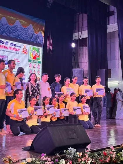 Our students lined up on stage, recognized for their beautiful yoga performance. We believe in providing platforms for our students to shine.
