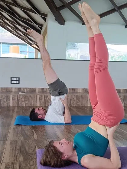Guests practicing Sarvangasana (Shoulder Stand), an inversion that offers numerous physical and mental benefits. Our instructors provide guidance to ensure safe and effective practice.