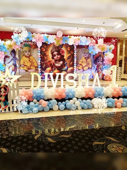 Another perspective of the elaborate Krishna-themed stage, showing the white picket fences and character cutouts that add depth and detail to the setup.