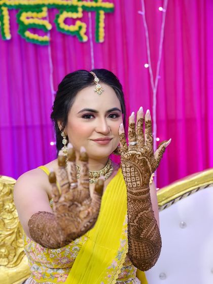 A close-up of the intricate henna work, a key part of the bridal look.