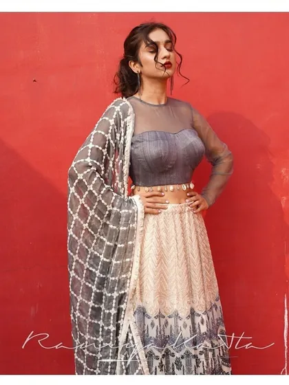 The full look of the grey and cream georgette lehenga, complete with a matching dupatta with a geometric pattern. A sophisticated choice for a modern event.