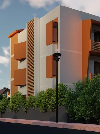 A sneak peek of a proposed G+2 residence in Guwahati. The design incorporates warm, earthy tones and cantilevered balconies, creating a modern yet inviting residential building.