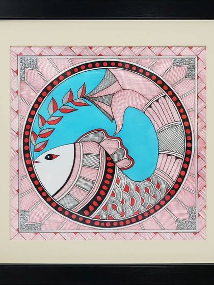 A symbolic Madhubani fish motif, representing prosperity, enclosed in a decorative circular frame.