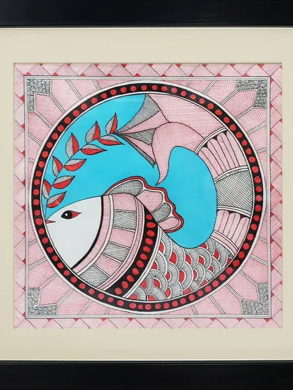 A fish is depicted within a circular frame in this pink-and-blue Madhubani piece by Rinki Joshi. The artwork uses traditional motifs and a soft color palette to create a serene and decorative image.
