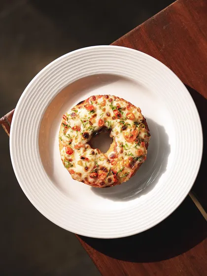 The Chilli Cheese Pizza Bagel is a simple yet incredibly delicious option, with melted cheese and a kick of chili.