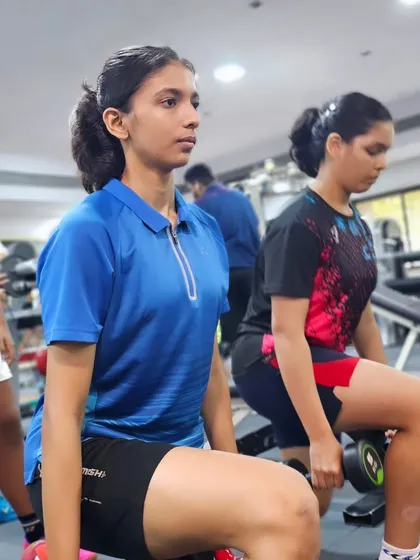 Players perform weighted lunges, a fundamental exercise for developing leg strength, balance, and stability for on-court movements.