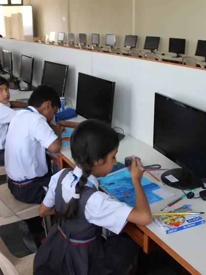 A long shot of the computer lab at St. Clare's School Unit II, filled with students during the 2023 Olympiad.