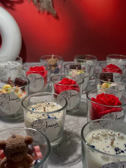 A closer look at the variety in my Valentine's shot glass candle collection. You can find 'LOVE' candles, teddy bear candles, rose candles, and even chocolate-themed ones.