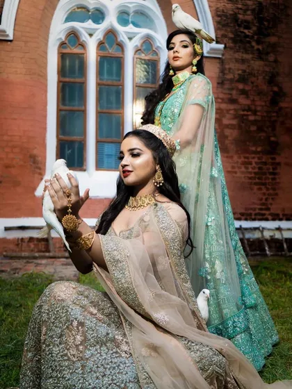 A themed photoshoot featuring my rental lehengas in pastel shades of beige and sea-green. These outfits are perfect for creating a coordinated look for bridesmaids.