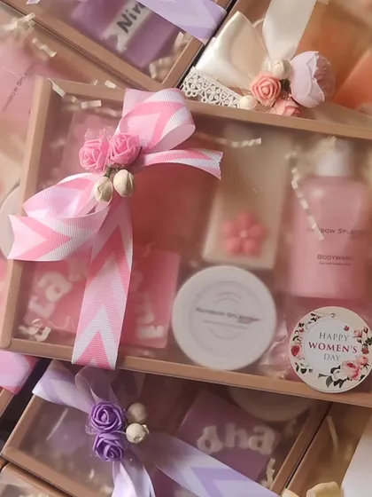 A beautifully wrapped pink-themed gift hamper, perfect for celebrating the women in your life.
