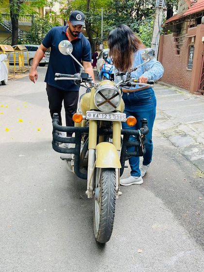 Guiding a student through the initial steps of moving the bike. This hands-on approach ensures safety and helps build a solid foundation for independent riding.