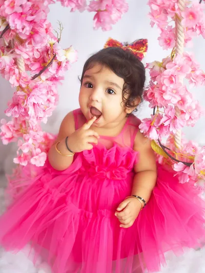 A curious and sweet moment from the same pink floral session. Her expression is absolutely precious.