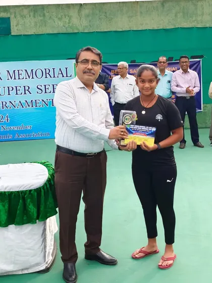 Eshita receiving her trophy after winning the AITA U-14 Super Series singles title. These are the moments that define a player's journey, and we are there every step of the way to guide them towards the podium.