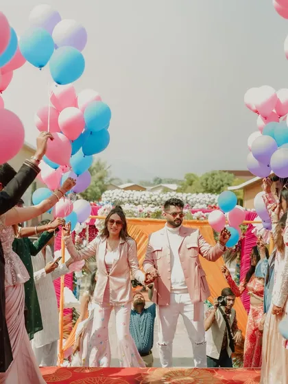 A sky full of dreams for this carnival entry. The couple walked through an aisle of friends and family holding colorful balloons, which were then released in a beautiful, celebratory moment.