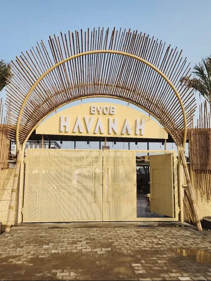 We create inviting atmospheres for commercial businesses. For Havanah, Faridabad's largest BYOB, we designed a tropical entrance with mature palms and bamboo accents to establish a resort-like vibe from the moment guests arrive.