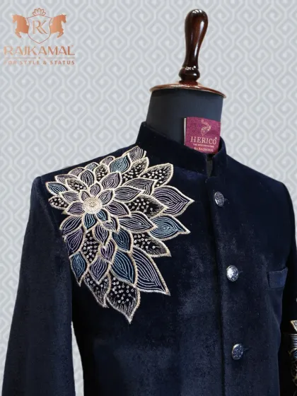 A closer look at the intricate floral embroidery on the shoulder of the navy blue velvet Bandhgala.