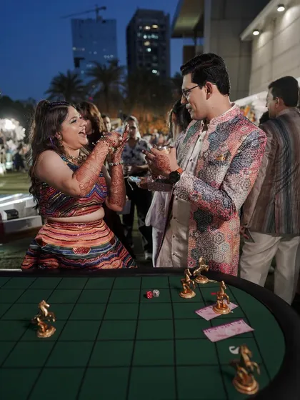 A moment of shared laughter and friendly competition at the game stall.