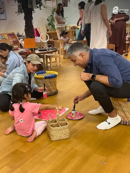 Learning is a partnership, and we invite parents to be a part of the journey. When a parent and child create together, they are not just painting; they are connecting, communicating, and building shared memories. These moments strengthen the bond between home and school.