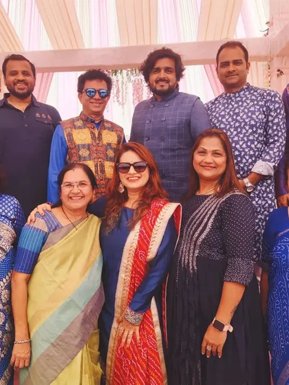 It's all about family. Posing with the wonderful families after back-to-back shows for a wedding in Roha.