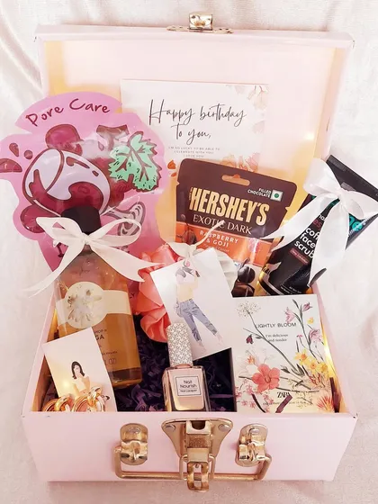 A gift for her, packed in a lovely pink trunk. This hamper is filled with skincare products, chocolates, and accessories, making it a perfect birthday treat.