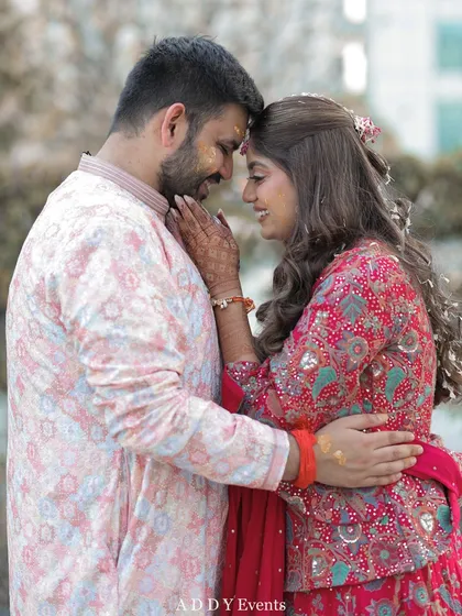 A romantic and intimate moment between the couple, their foreheads touching, capturing the deep connection and love they share.