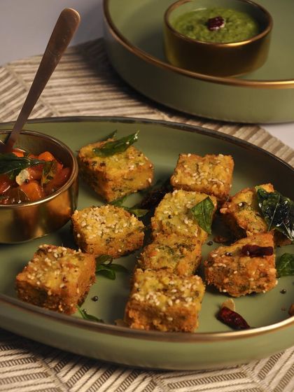 A taste of Maharashtra with my Kothimbir Vadi. These savory cilantro cakes are served with a tangy homemade tomato chutney, offering a unique and traditional Indian snack option for your event.