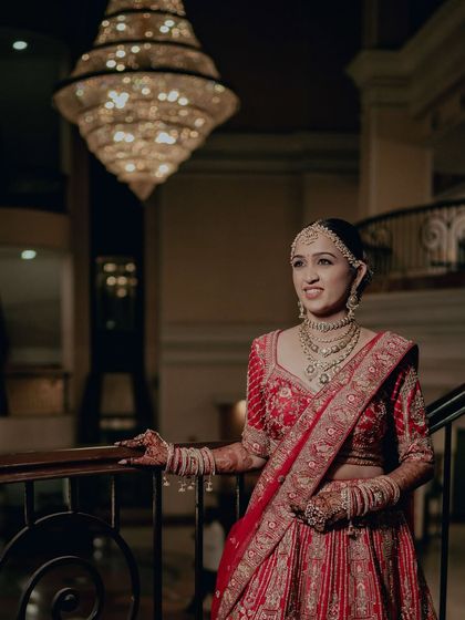 The grandeur of the venue is matched by the grandeur of the bride. Her makeup is elegant and sophisticated, perfect for her royal wedding.
