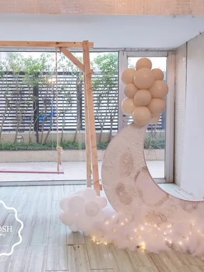 To add a touch of interactive charm, I included a beautiful wooden swing and a light-up moon prop, creating a perfect photo opportunity for guests.