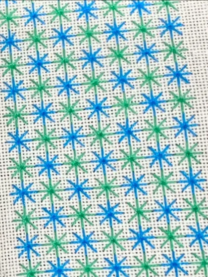 A close-up of a star-like stitch sampler. Learning embroidery is a great way to update your creative skills.