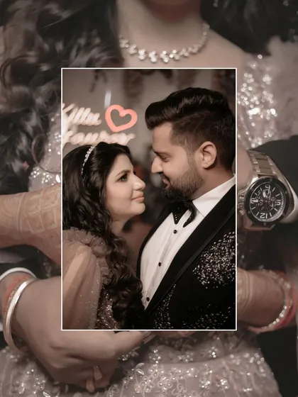An artistic shot of the couple, with their hands holding in the foreground and their loving expressions in a framed close-up.