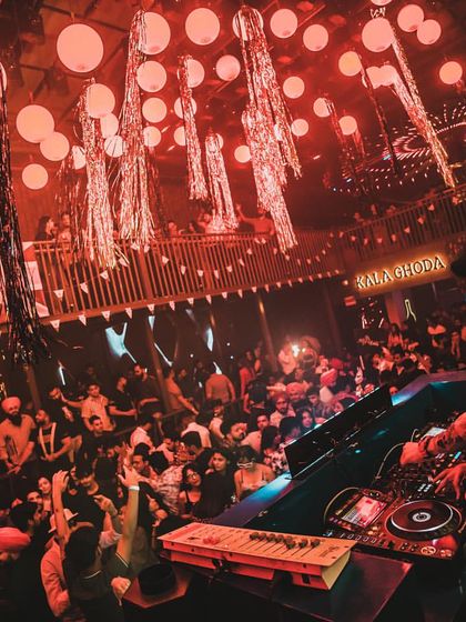 A wide shot of the unique decor at the Kala Ghoda club, with red lanterns creating a distinct atmosphere for my set.