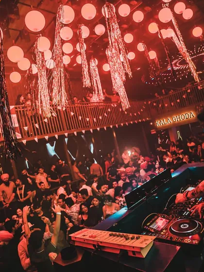 A wide shot of the unique decor at the Kala Ghoda club, with red lanterns creating a distinct atmosphere for my set.