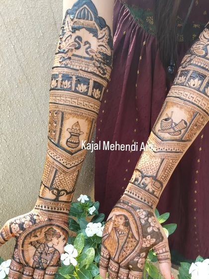 A full bridal design telling a complete story. From the couple's portraits on the palms to the depiction of wedding rituals like the kalash and doli on the arms, every element is thoughtfully placed.