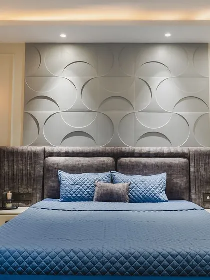 Your bedroom should be your personal sanctuary. For this master bedroom, I used a calming palette of blues and greys, a textured 3D panel behind the bed, and soft, indirect lighting to create a space that feels both spacious and deeply relaxing.