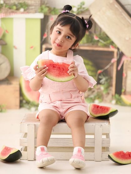 A refreshing watermelon-themed shoot, perfect for a summer baby. The bright colors and fun props make for a unique and playful portrait.