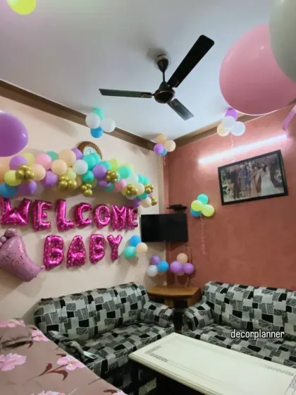 Another angle of the vibrant welcome decor at the grandmother's house. The room is filled with balloons on the ceiling and walls, showing a simple yet effective way to make a space feel special.