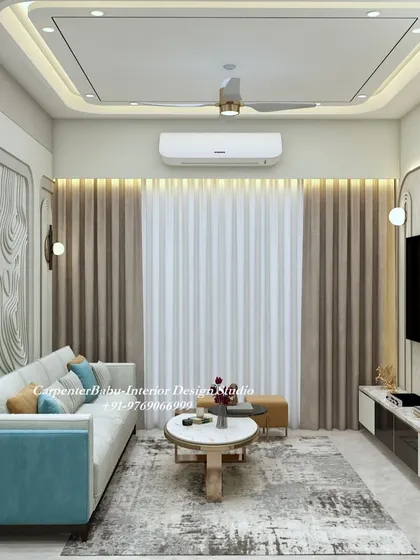 A cozy living room setup with a light-colored sofa and a turquoise armchair. The wall behind the sofa features a 3D design and a subtle wallpaper, adding layers of texture.
