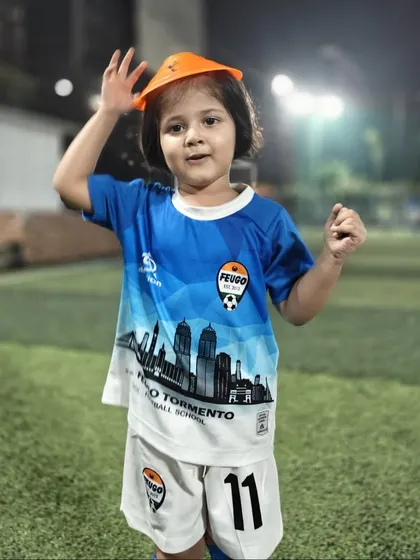 A young girl in our toddler program enjoying a training session under the lights.