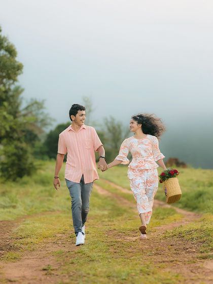 A romantic walk down a country path, complete with a picnic basket. Themed shoots like this add a personal and story-driven element.