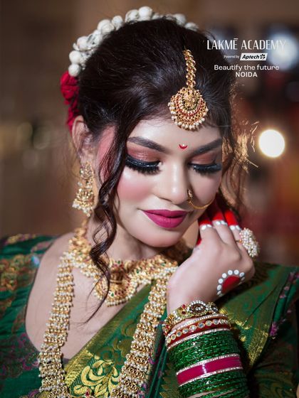 A beautiful profile shot of the South Indian inspired look, showing the detailed hair and makeup from another angle.