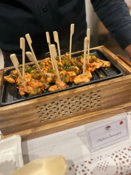 Chicken Chongquing skewers, ready to be served. This dish brings a wonderful, spicy kick to our appetizer menu and is always a conversation starter at events.