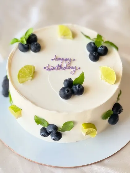 My most popular creation, the signature Italian Lemon & Blueberry cake. I offer many design variations, all featuring fresh blueberries, zesty lime, and smooth buttercream.