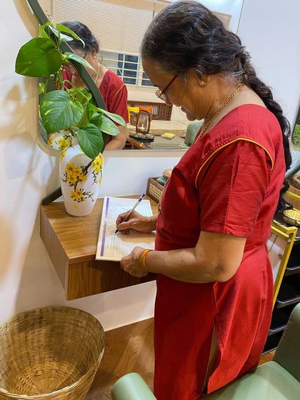 A client taking a moment to fill out our feedback form. I value every word, as it helps me continue to improve and serve you better.