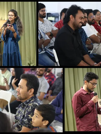 A young performer shares her poetry while the audience listens intently.