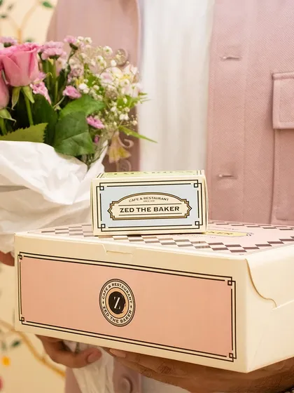 The perfect gift combination: a box of my pastries, a smaller box of macarons, and a beautiful bouquet of fresh flowers.