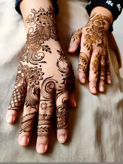 A closer view of the floral and swirl design, highlighting the fine details.