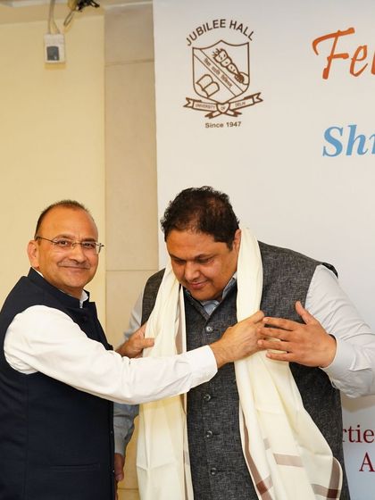 A moment of respect and tradition, as I am honored with a shawl during the felicitation event. I am grateful for the connections and friendships forged through our shared legal journey.