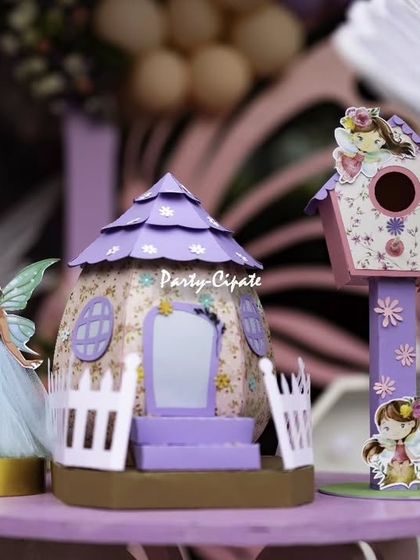Custom props make a party unique. These little fairy houses and dolls were handcrafted to fit the specific color scheme and style of this enchanted birthday.