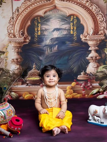 This little one looks so sweet and happy in his Krishna costume, ready to celebrate Janmashtami.